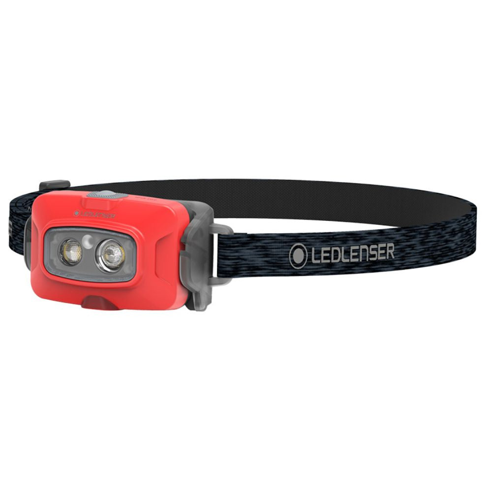 Red Ledlenser headtorch with black strap on a white background